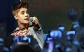             Justin Bieber apologizes to fans for vomiting on stage
      