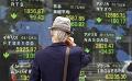             Asian shares, riskier assets fall; dollar gains on growth concerns
      