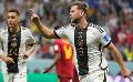             Germany score late for crucial draw against Spain
      