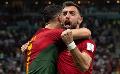             Fernandes double sends Portugal into last 16
      